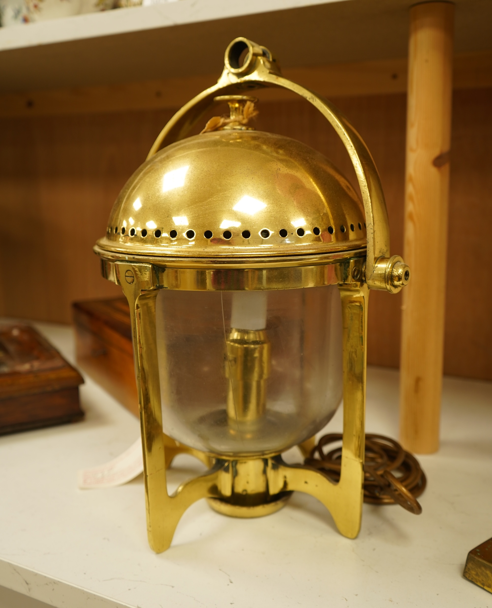 A brass ship's lamp on gimble, 41cm high